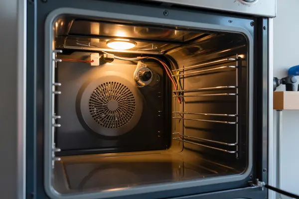 side view of an open oven door