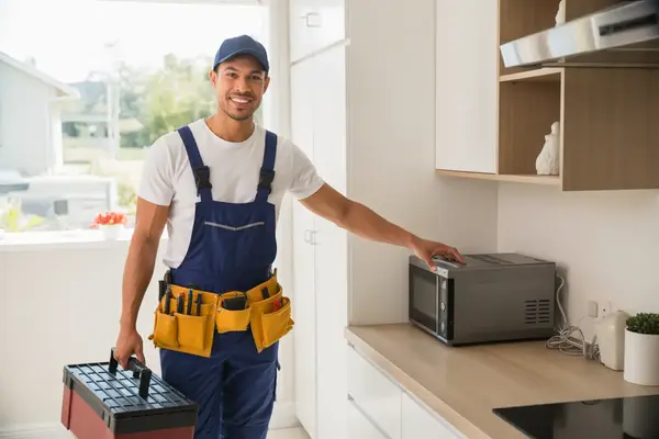 technician arriving at a customer's home carrying a toolbox